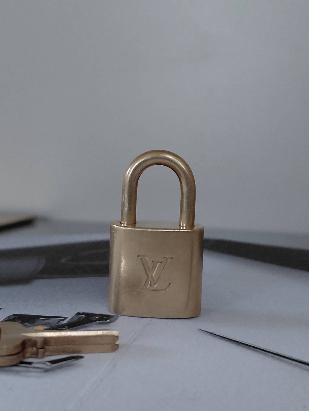 Louis Vuitton Brass-tone Padlock in Gold